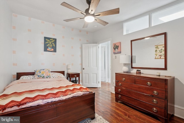 bedroom with a ceiling fan and wood finished floors