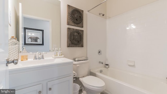 bathroom with toilet, tub / shower combination, and vanity