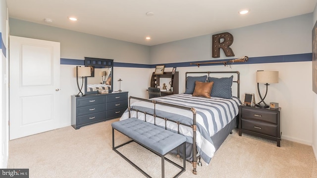 bedroom with recessed lighting and light colored carpet