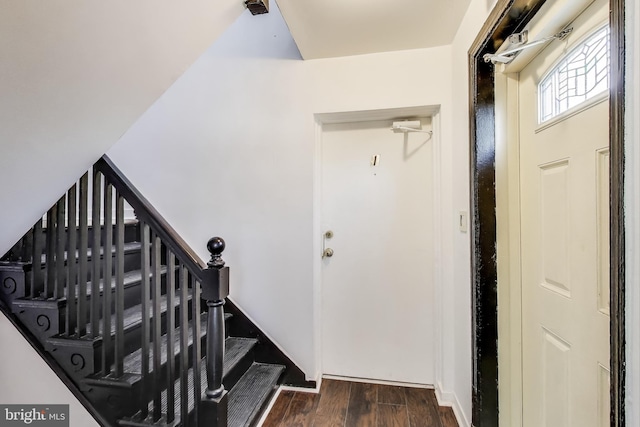 stairway with wood finished floors