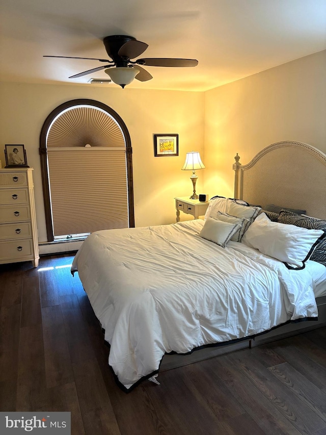 bedroom featuring dark wood-type flooring and ceiling fan