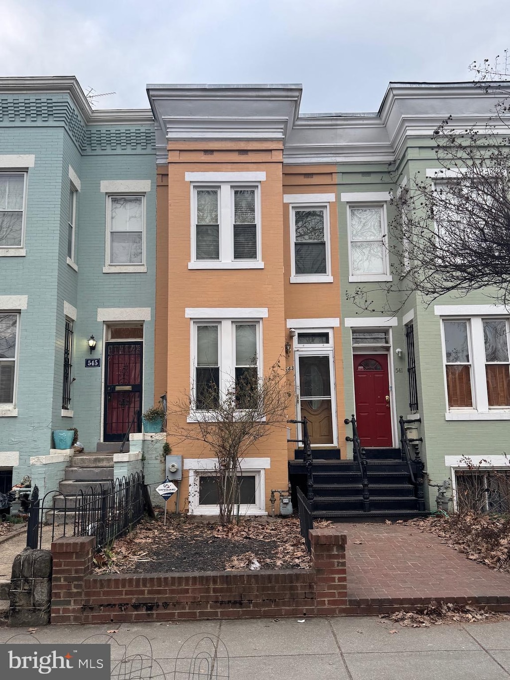 multi unit property with entry steps and brick siding