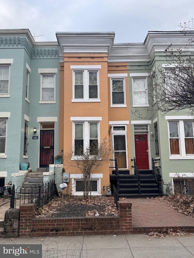 multi unit property with entry steps and brick siding