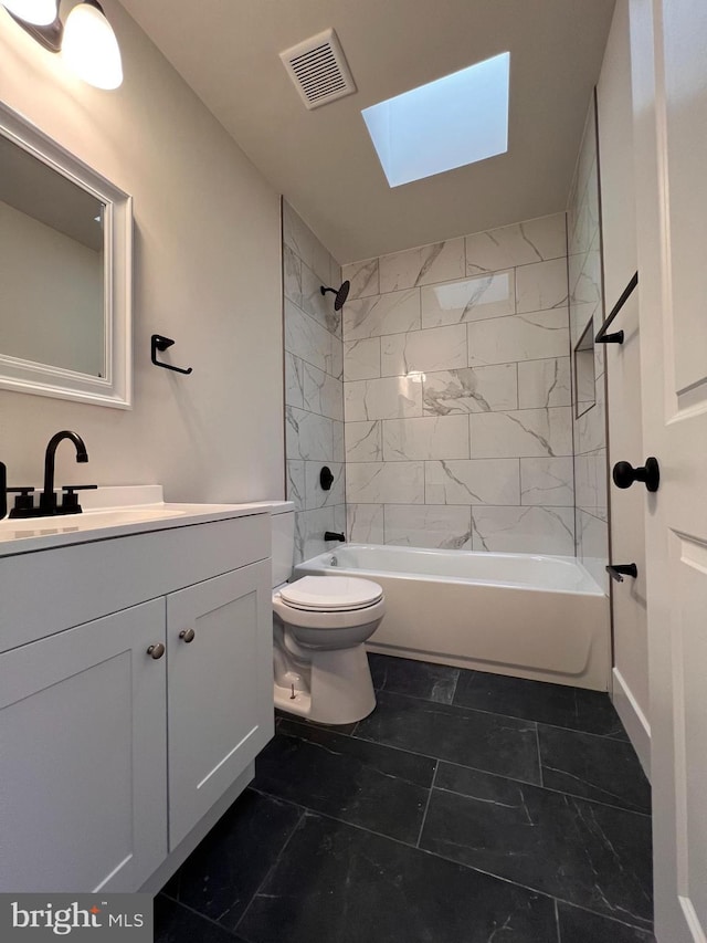 full bathroom with a skylight, visible vents, toilet, bathtub / shower combination, and vanity