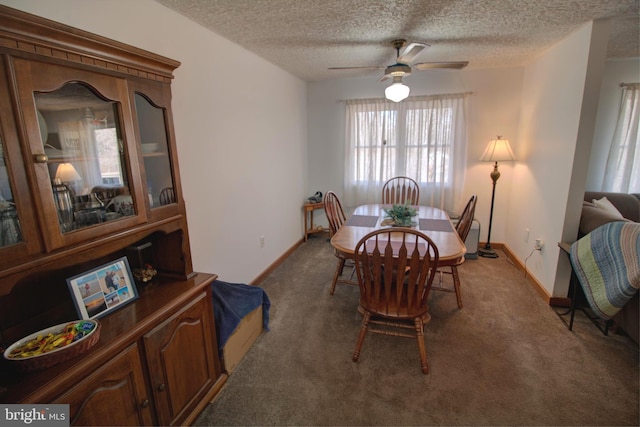 carpeted dining room featuring a textured ceiling, ceiling fan, and baseboards