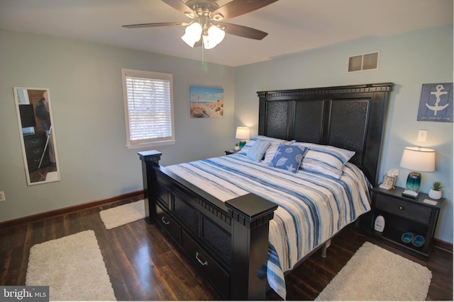 bedroom featuring baseboards, visible vents, ceiling fan, and wood finished floors