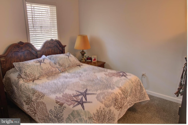 bedroom featuring carpet flooring and baseboards