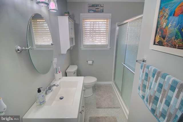 full bath featuring a stall shower, baseboards, vanity, and toilet