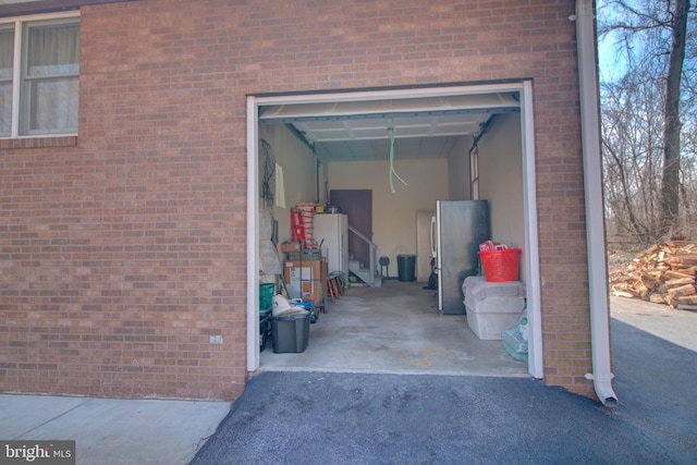 garage with freestanding refrigerator