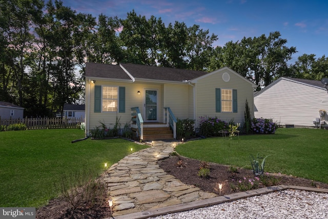 single story home featuring fence and a front yard