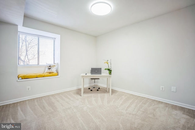 unfurnished office featuring carpet flooring and baseboards