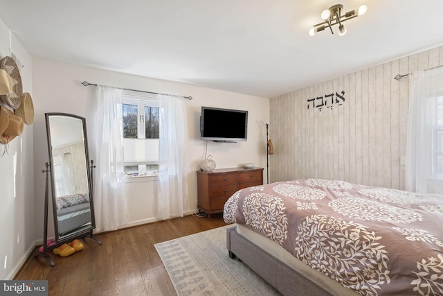 bedroom featuring wood finished floors