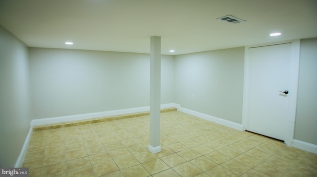 finished basement featuring recessed lighting, visible vents, baseboards, and light tile patterned flooring