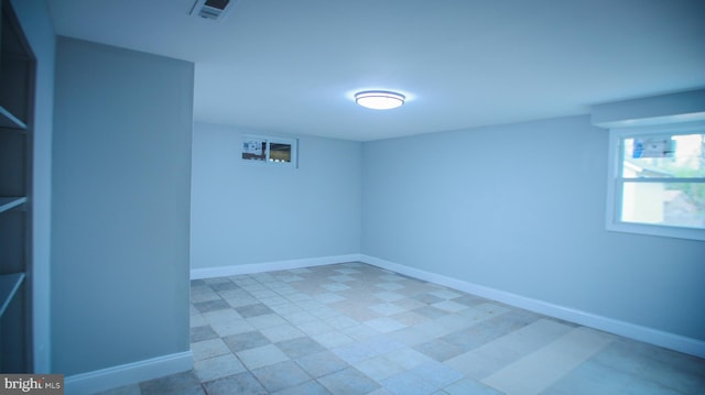 empty room featuring visible vents and baseboards