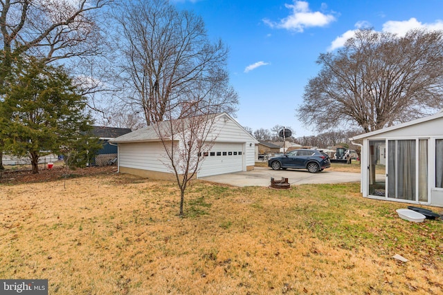 view of yard featuring an outbuilding and a detached garage