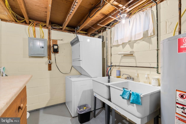 laundry room featuring laundry area, electric panel, a sink, stacked washer / drying machine, and gas water heater