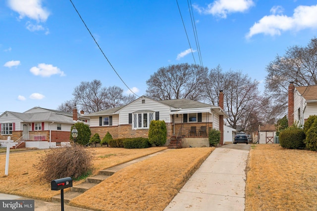 bungalow-style house featuring driveway, brick siding, and a chimney