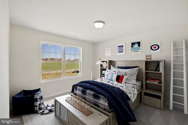 bedroom with carpet and baseboards