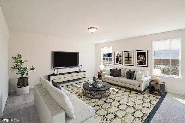 living area featuring light carpet and baseboards