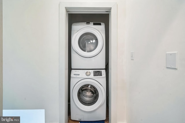 laundry area with laundry area and stacked washing maching and dryer