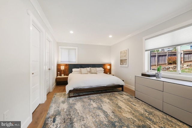 bedroom featuring recessed lighting, baseboards, and wood finished floors