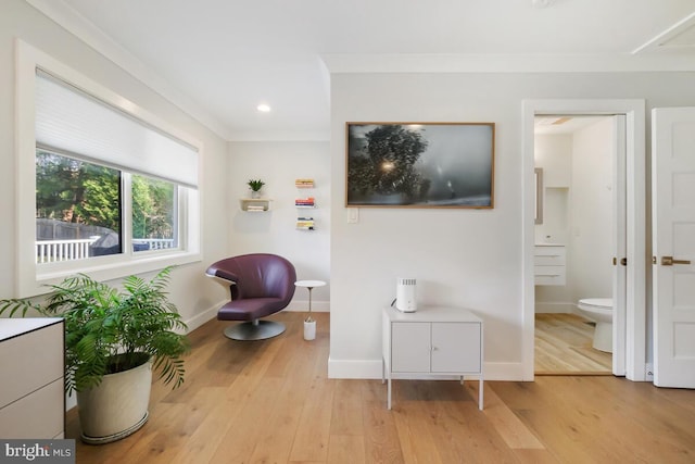 sitting room featuring recessed lighting, ornamental molding, baseboards, and wood finished floors
