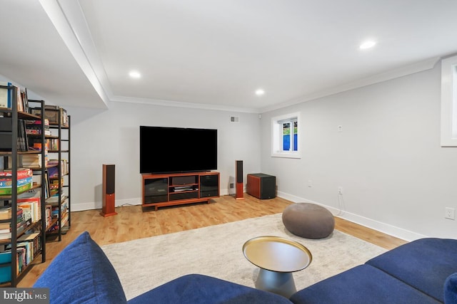 living area featuring recessed lighting, wood finished floors, baseboards, and ornamental molding