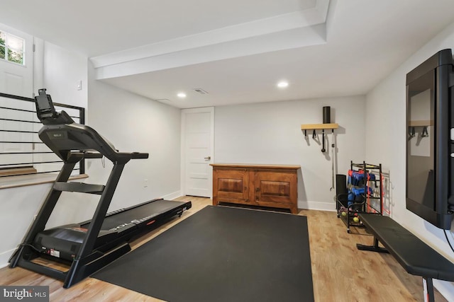 workout room with visible vents, recessed lighting, baseboards, and wood finished floors