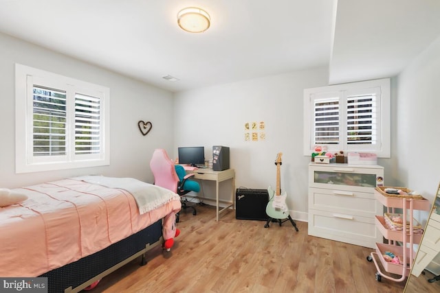 bedroom featuring wood finished floors