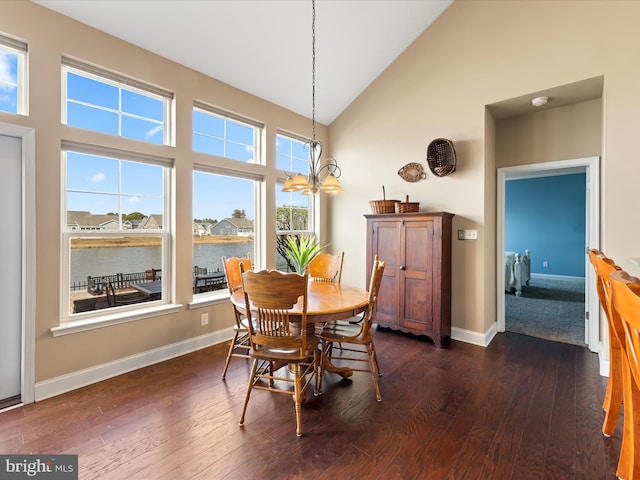 dining space with dark wood-style floors, baseboards, and high vaulted ceiling