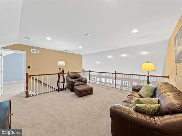 living area with visible vents, recessed lighting, and carpet