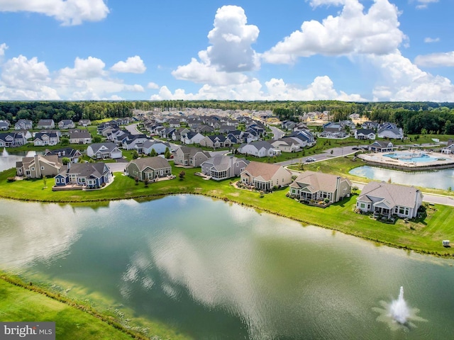 birds eye view of property with a residential view and a water view
