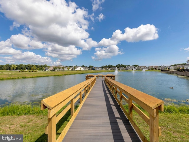 dock area with a water view and a residential view