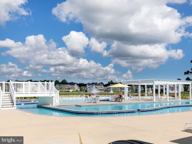 community pool featuring a patio and a pergola