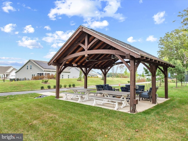 view of home's community with a gazebo, a yard, and a patio area