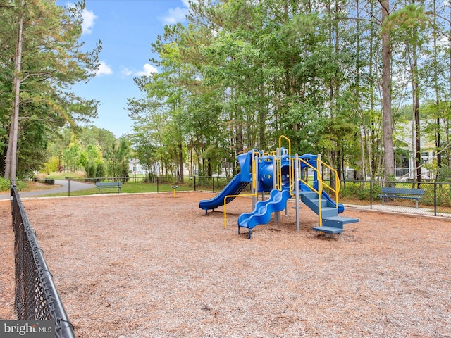 community jungle gym featuring fence