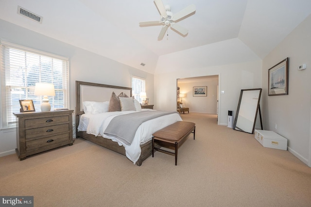 bedroom featuring lofted ceiling, light carpet, a ceiling fan, visible vents, and baseboards