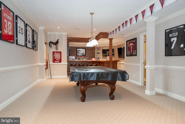 recreation room featuring baseboards, carpet, decorative columns, and crown molding