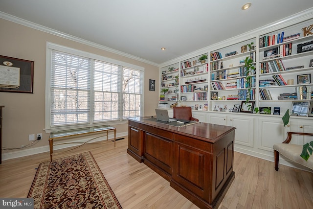 office featuring built in features, visible vents, ornamental molding, light wood-type flooring, and baseboards