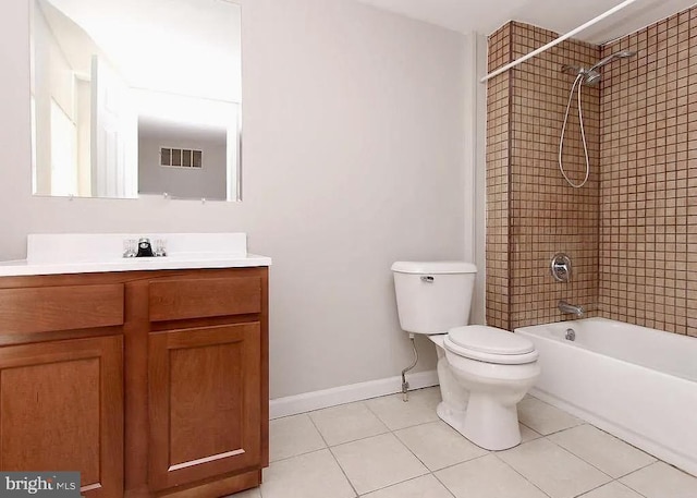 bathroom with toilet, tile patterned flooring, baseboards, and vanity