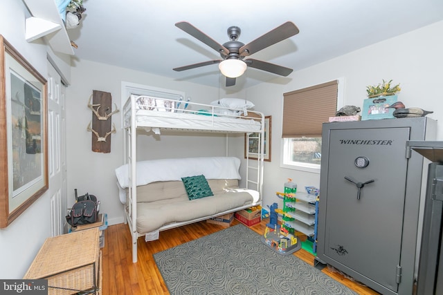 bedroom featuring ceiling fan and wood finished floors