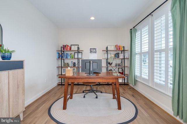 office with recessed lighting, light wood-style flooring, and baseboards