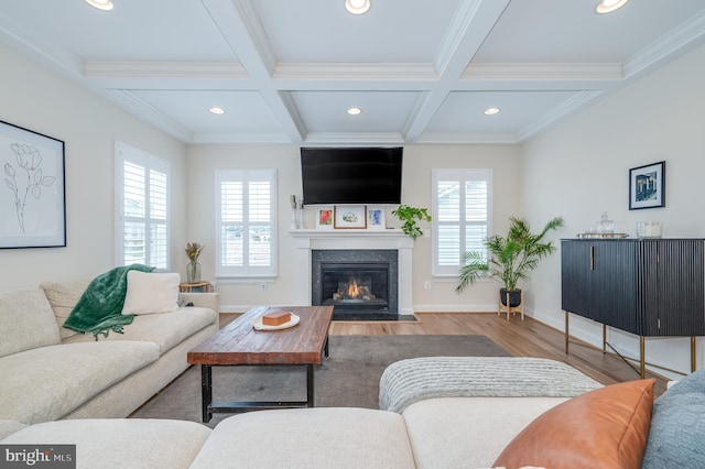 living room featuring a wealth of natural light, beam ceiling, coffered ceiling, and wood finished floors