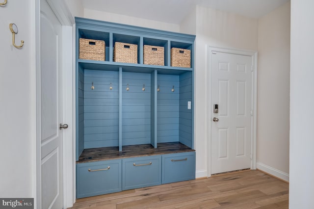 mudroom with light wood-type flooring and baseboards