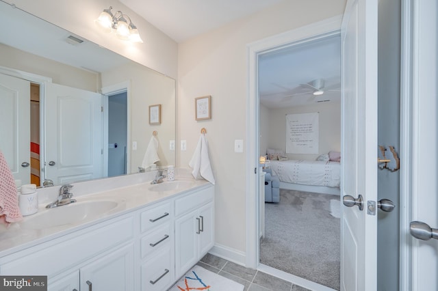 bathroom featuring double vanity, tile patterned flooring, a sink, and visible vents