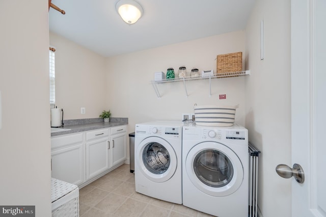 clothes washing area featuring light tile patterned floors and independent washer and dryer