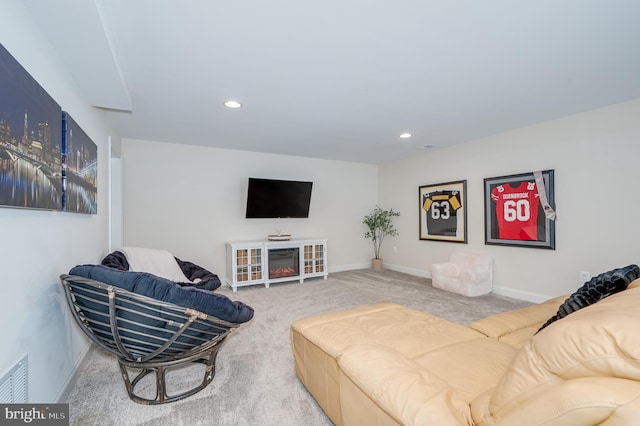 living room featuring carpet, visible vents, baseboards, and recessed lighting