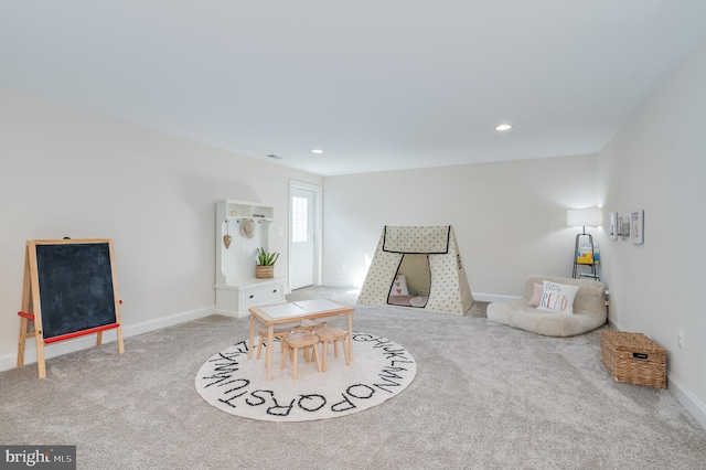 sitting room featuring recessed lighting, carpet flooring, and baseboards