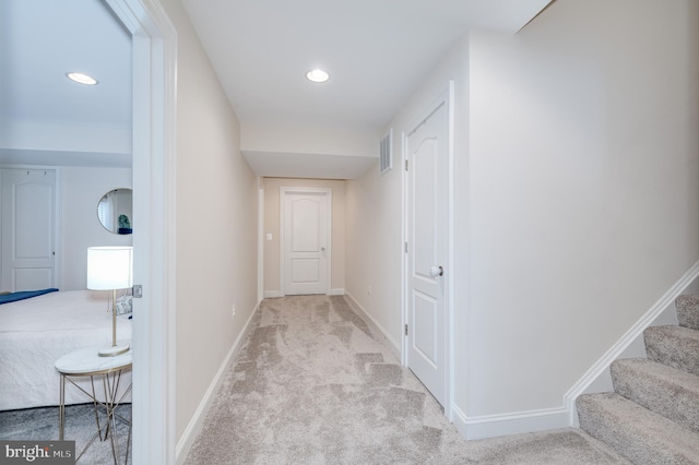 corridor with stairs, carpet floors, recessed lighting, and baseboards