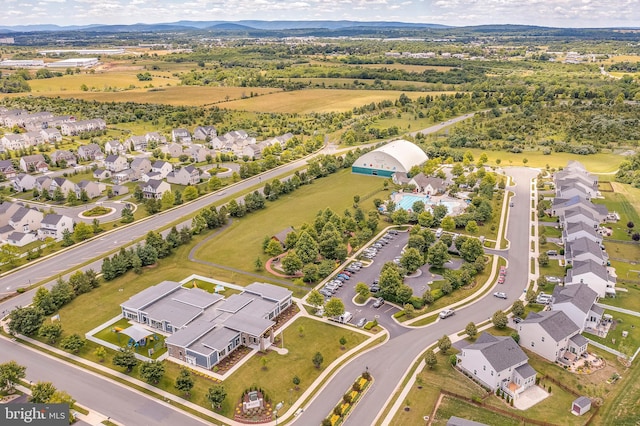 birds eye view of property with a residential view